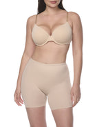 a woman wearing a beige padded butt shaping short