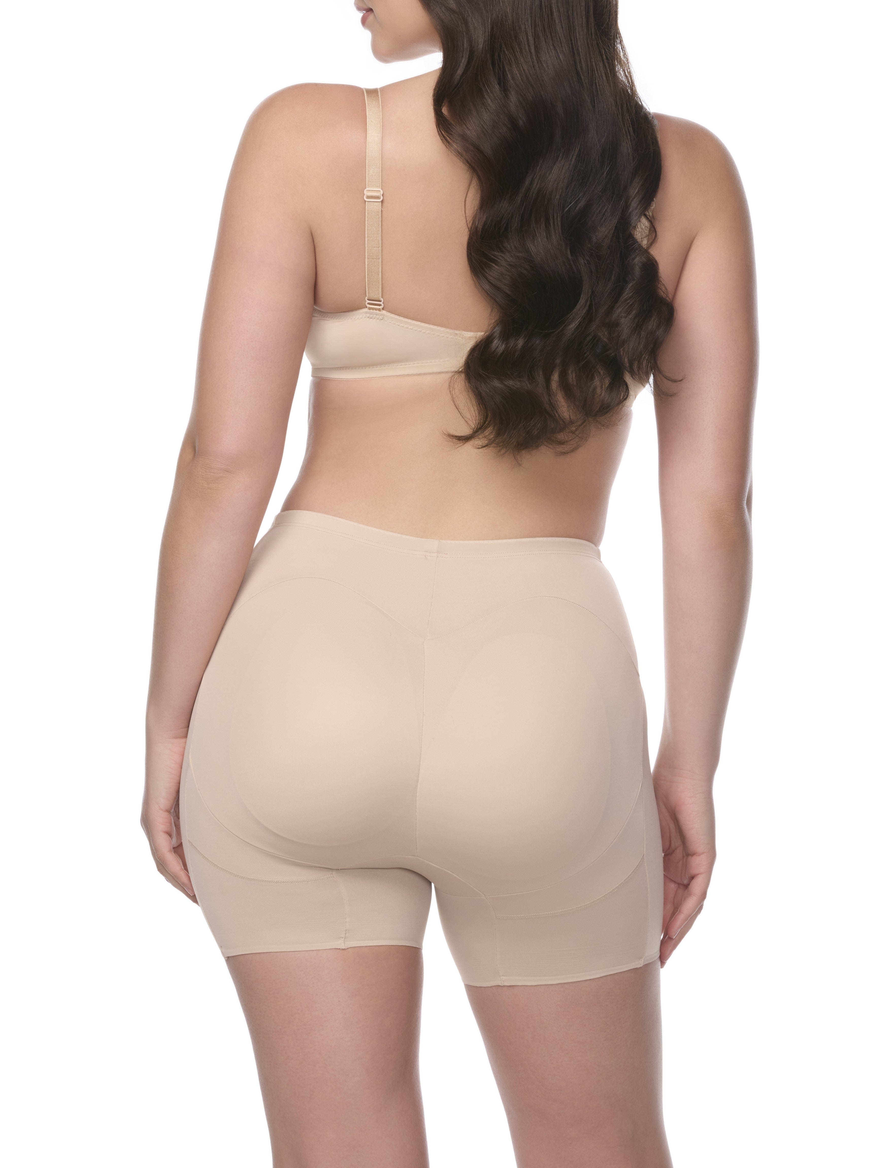 a woman wearing a beige padded butt shaping short