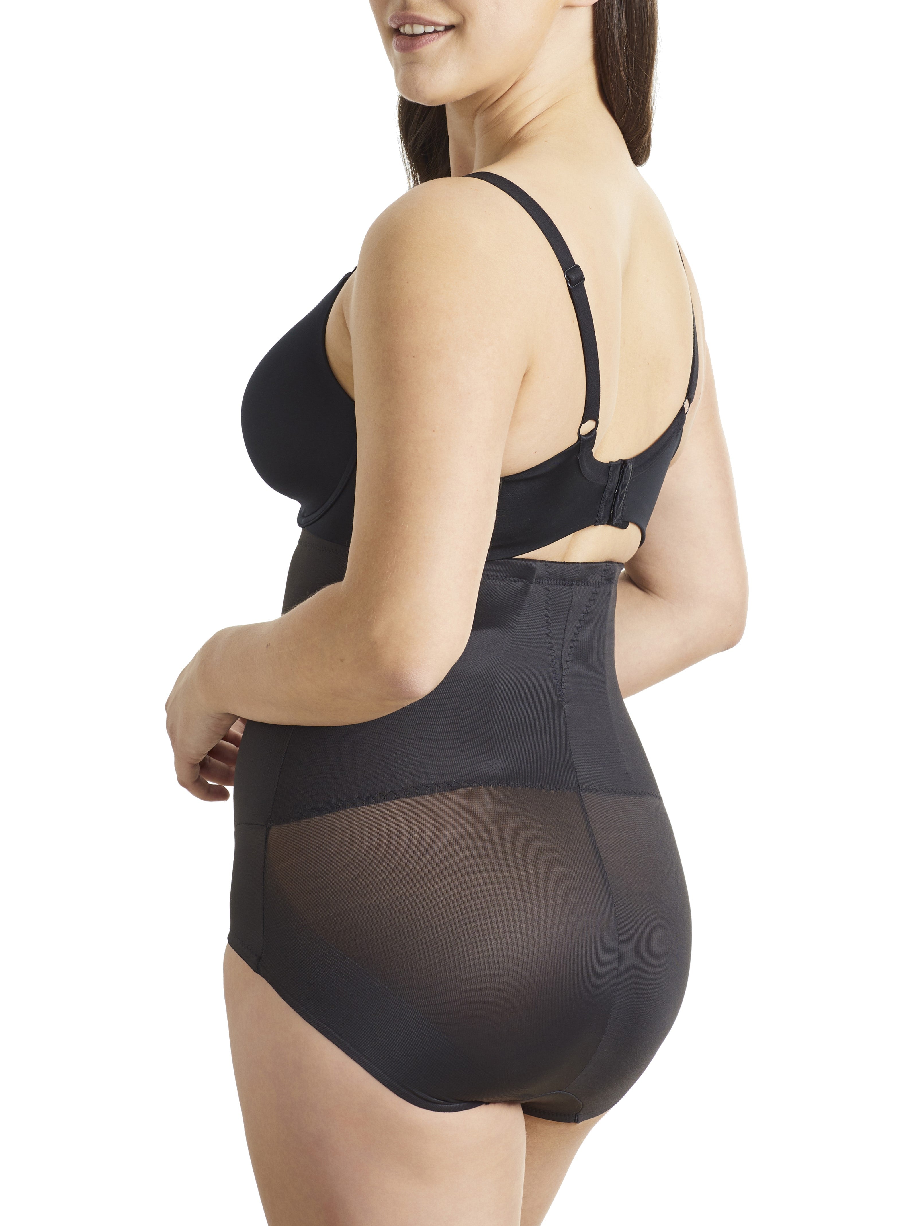 a woman wearing black high waisted tummy control underwear