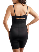 a woman wearing a black high waisted tummy control shapewear short