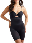 a woman wearing a black high waisted tummy control shapewear short