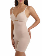 a woman wearing a nude high waisted tummy control shapewear short