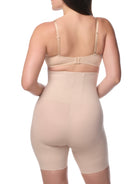a woman wearing a beige high waisted thigh slimmer shapewear