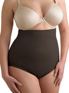 a woman wearing black plus size high waisted tummy control underwear shapewear