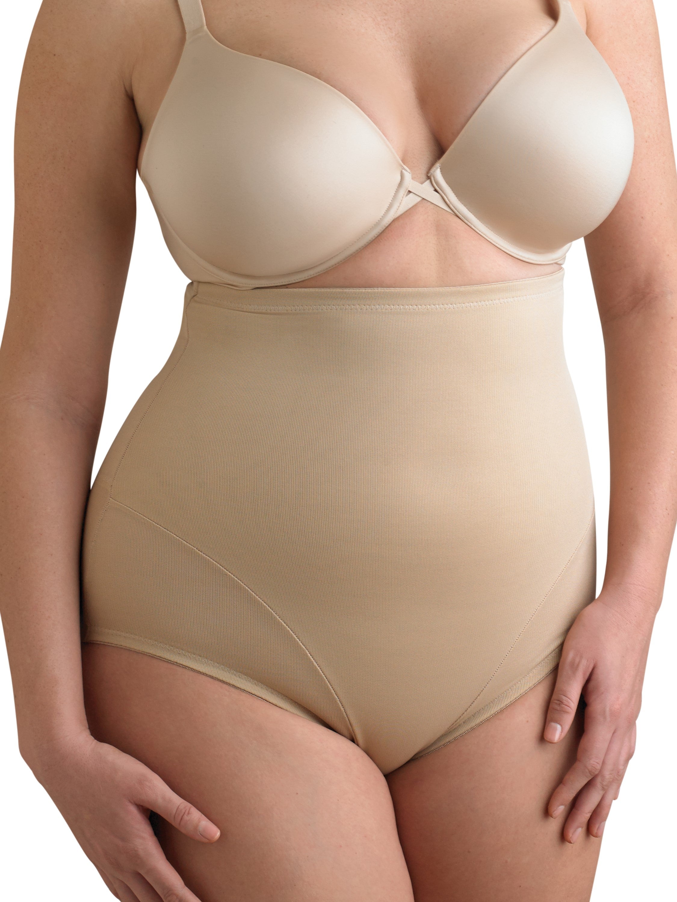 a woman wearing a beige shaping brief