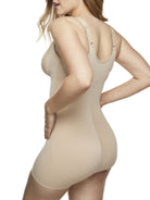 a woman wearing a nude open bust tummy control body shaper shapewear