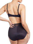 a woman wearing black tummy control underwear shapewear