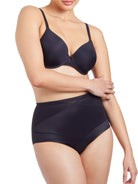 a woman wearing black tummy control underwear shapewear