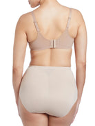 a woman wearing nude tummy control underwear shapewear