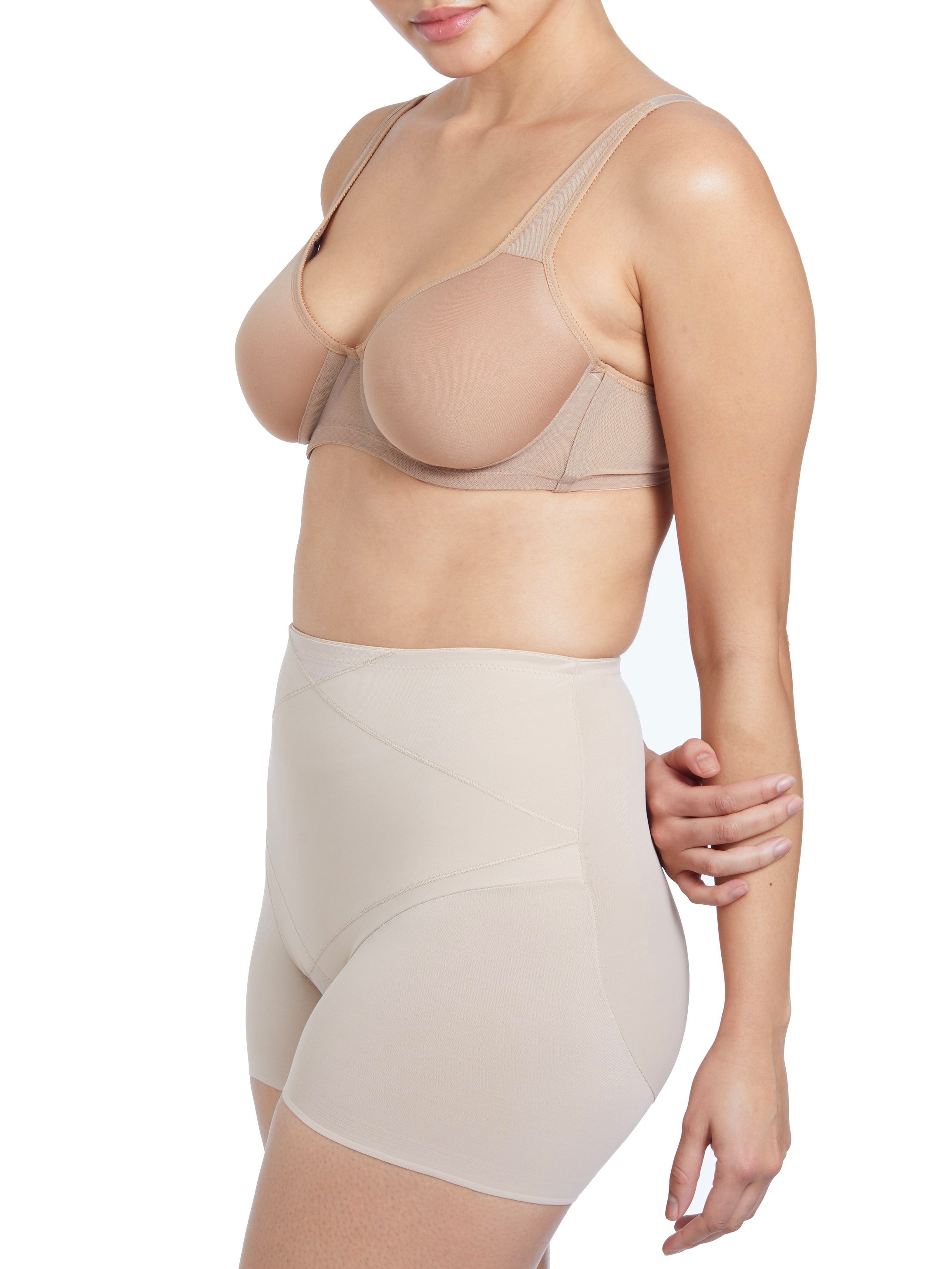 a woman wearing nude tummy control shapewear shorts