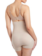 a woman wearing nude high waisted tummy control shapewear shorts