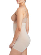 a woman wearing nude high waisted tummy control shapewear shorts