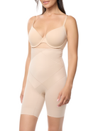 a woman wearing a beige high waisted body shaper short