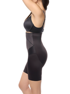 a woman wearing a black high waisted body shaper short