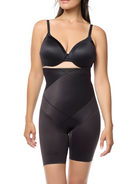 a woman wearing a black high waisted body shaper short