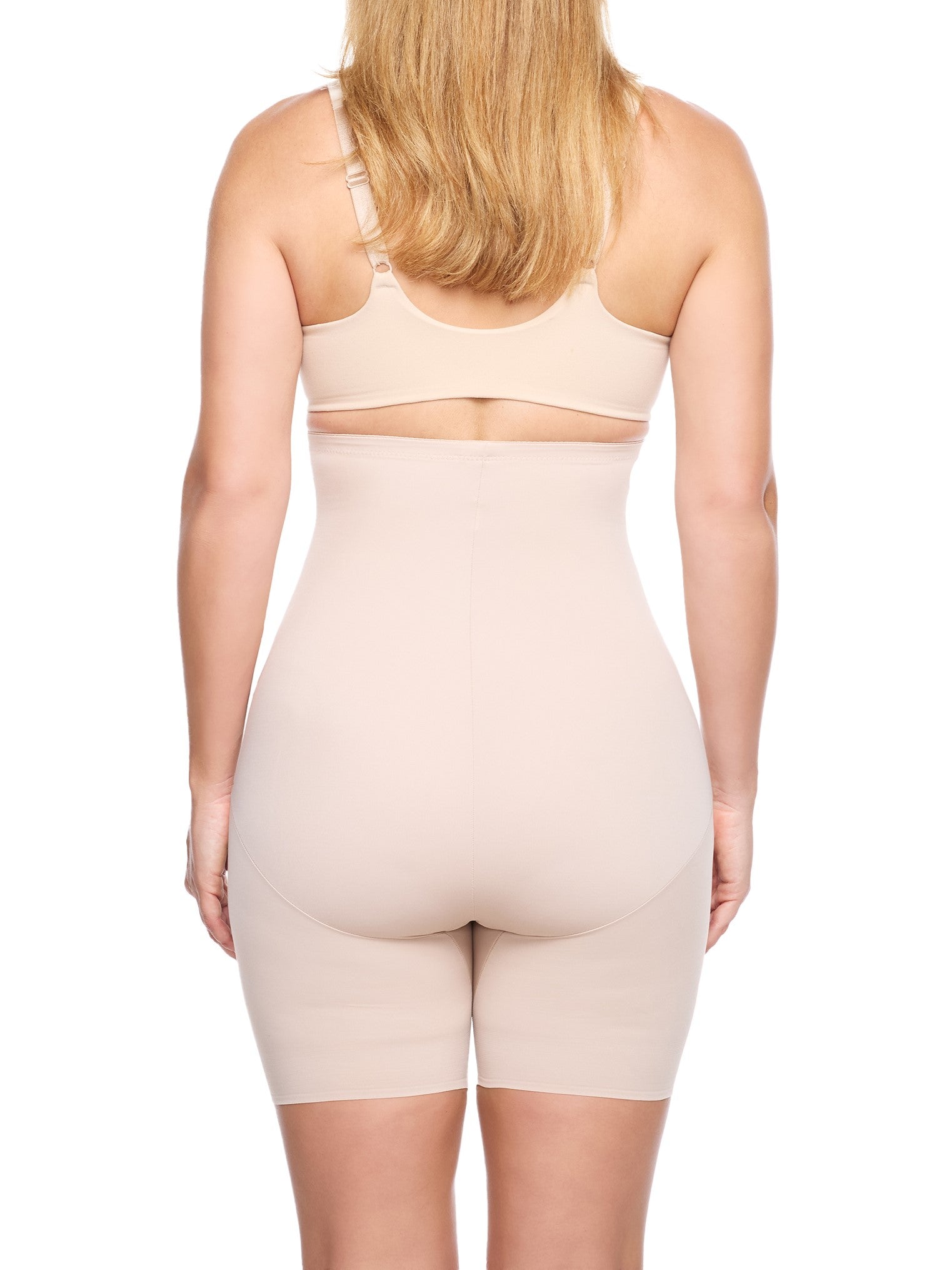 a woman wearing a nude high waisted tummy control shapewear short