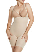 a woman wearing a beige open-bust shaping bodysuit romper