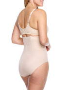 a woman wearing nude high waisted tummy control underwear shapewear