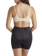 a woman wearing black tummy control shapewear shorts