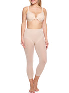 a woman wearing a beige sheer shaping legging