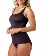 a woman wearing a black shaping camisole tank top shapewear