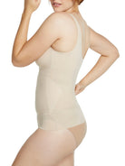 a woman wearing a nude shaping camisole tank top shapewear