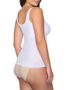 a woman wearing a white tummy control shaping camisole shapewear