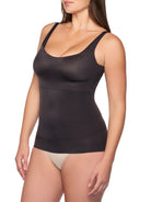 a woman wearing a black tummy control shaping camisole shapewear