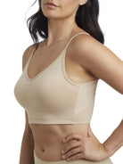 a woman wearing a nude shaping wireless bra bralette