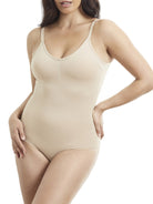 a woman wearing a nude body shaper shaping bodysuit shapewear