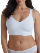 a woman wearing a white lounge bra