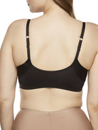 a woman wearing a black wireless bra