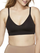 a woman wearing a black bralette