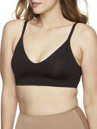 a woman wearing a black bralette