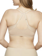 a woman wearing a nude bralette