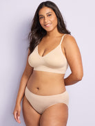 a woman wearing a nude wireless bra all-groups