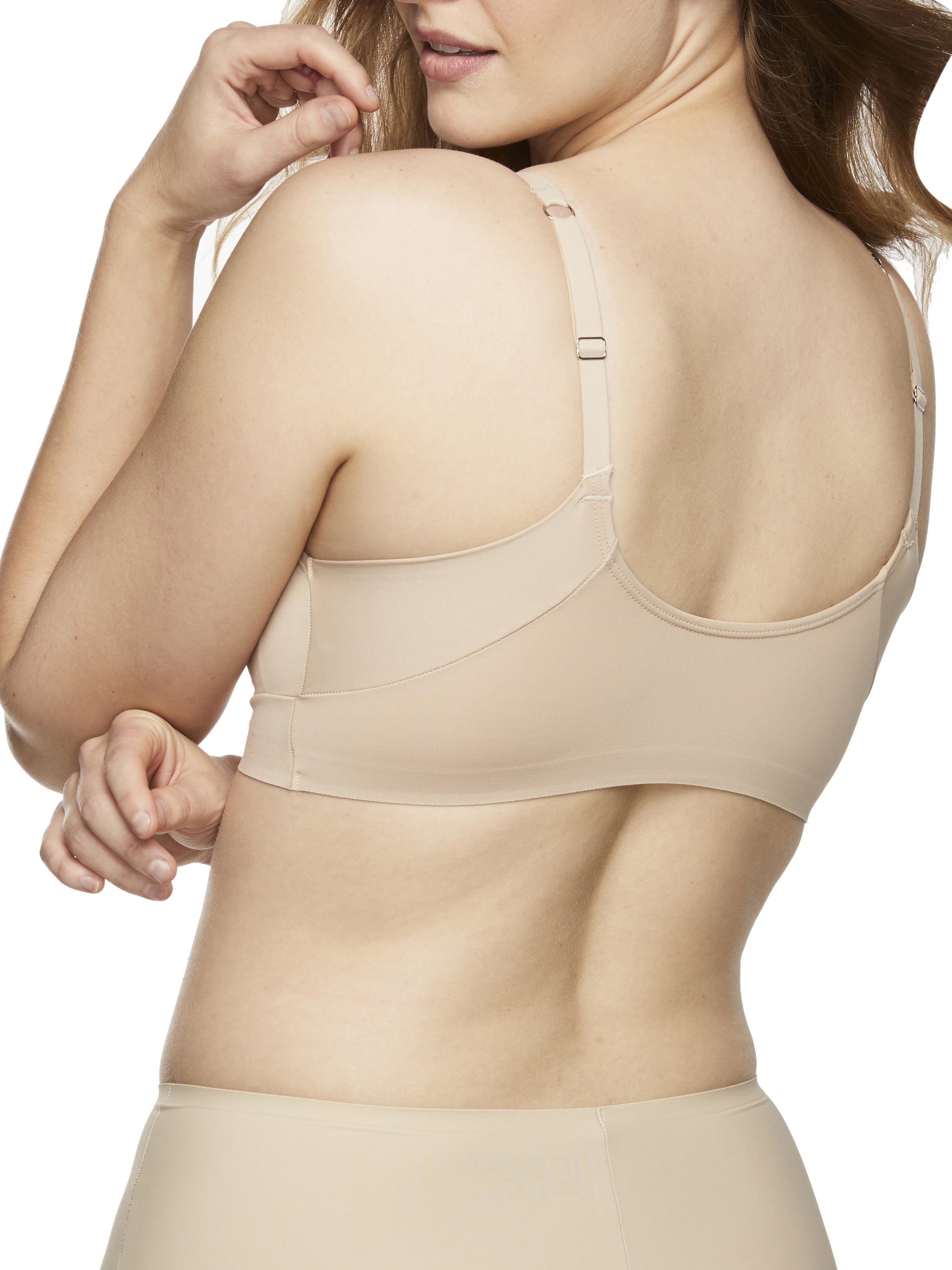 a woman wearing a beige lounge bra