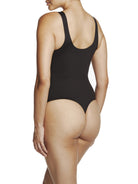 a woman wearing a black tummy control thong body shaper bodysuit shapewear