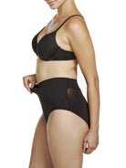 a woman wearing black tummy control underwear