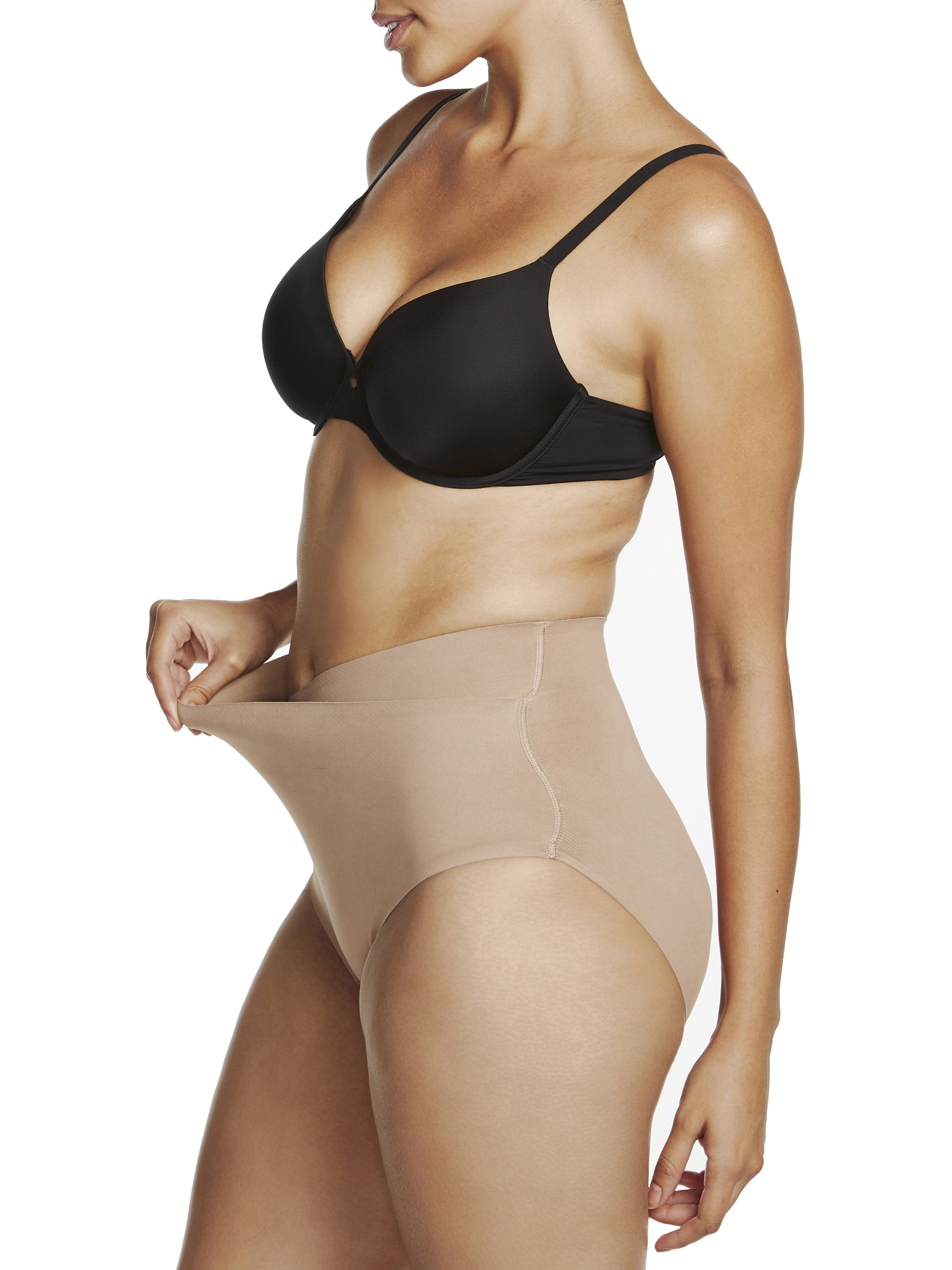 a woman wearing a beige shaping brief