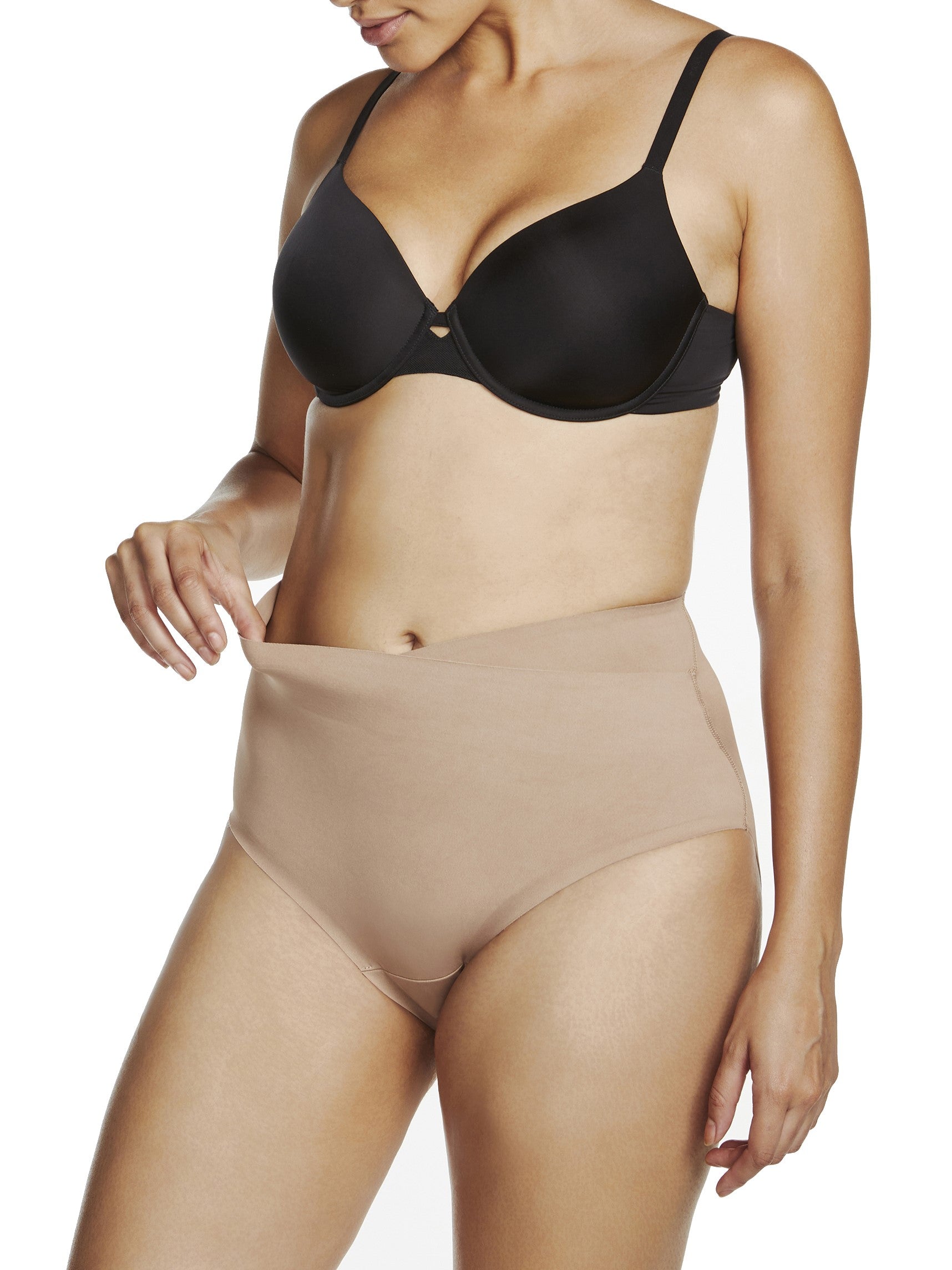 a woman wearing a beige shaping brief