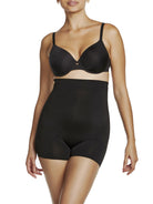 a woman wearing black high waisted tummy control shapewear shorts