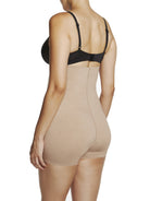 a woman wearing nude high waisted tummy control shapewear shorts