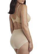 a woman wearing nude tummy control underwear