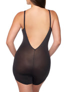 a woman wearing a black slanted hem body shaper