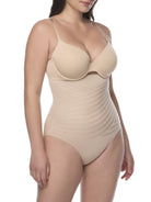 Beige shapewear brief worn by a model on a white background