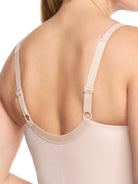 a close up detail on a woman wearing a nude tummy control body shaper shapewear