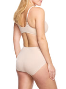 a woman wearing nude tummy control underwear