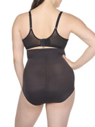 a woman wearing black high waisted tummy control underwear shapewear