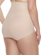 a woman wearing a beige shaping brief